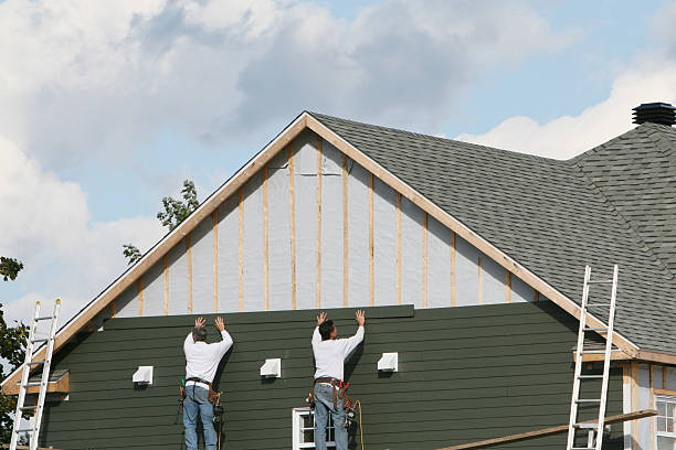 Professional Storm Damage Siding Repair technician working in Kinsman, OH